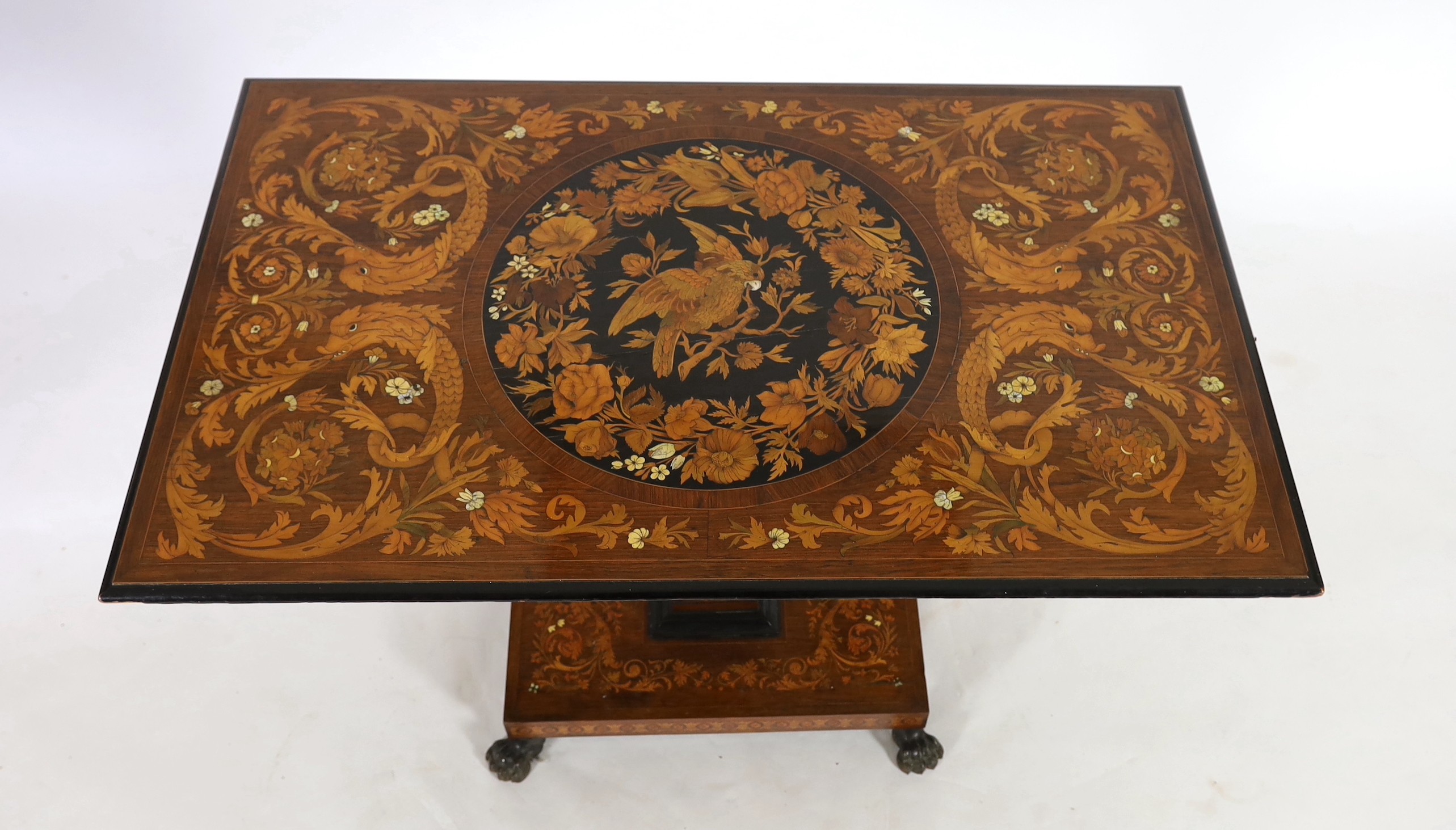 A 19th century Dutch walnut and marquetry tilt top centre table 117 x 72cm. Height 78cm.